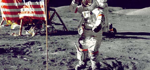 astronaut standing on moon beside U.S.A. flag by NASA courtesy of Unsplash.